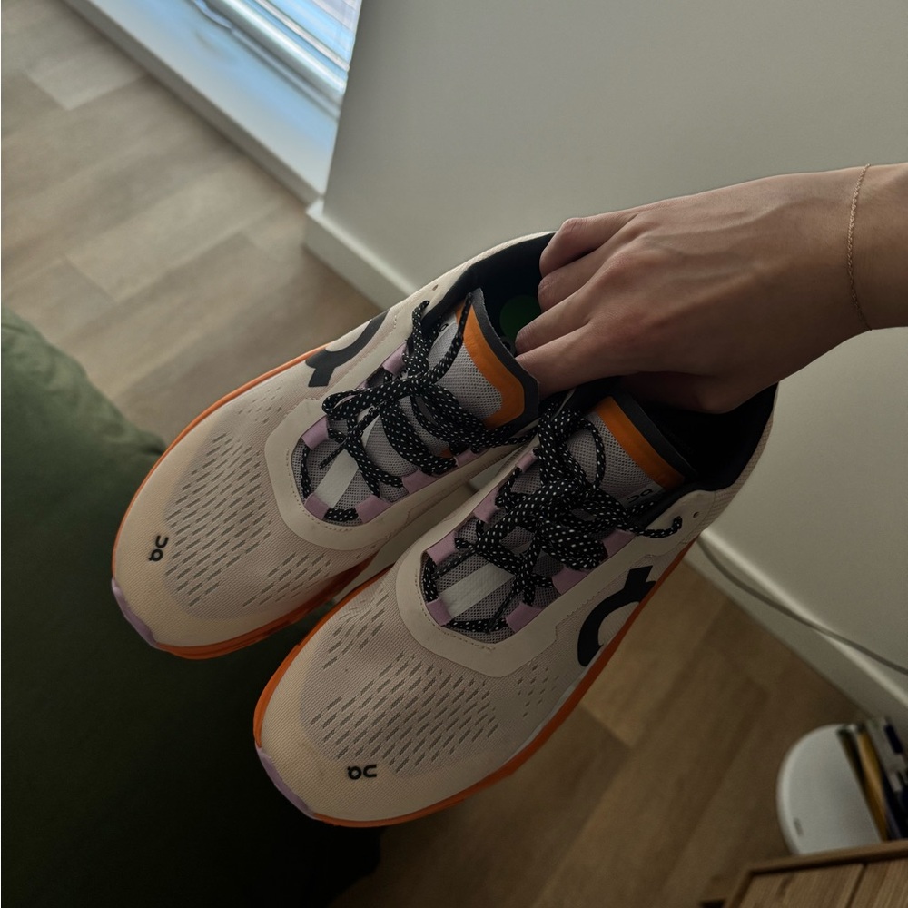 On Running White and Orange Sneakers